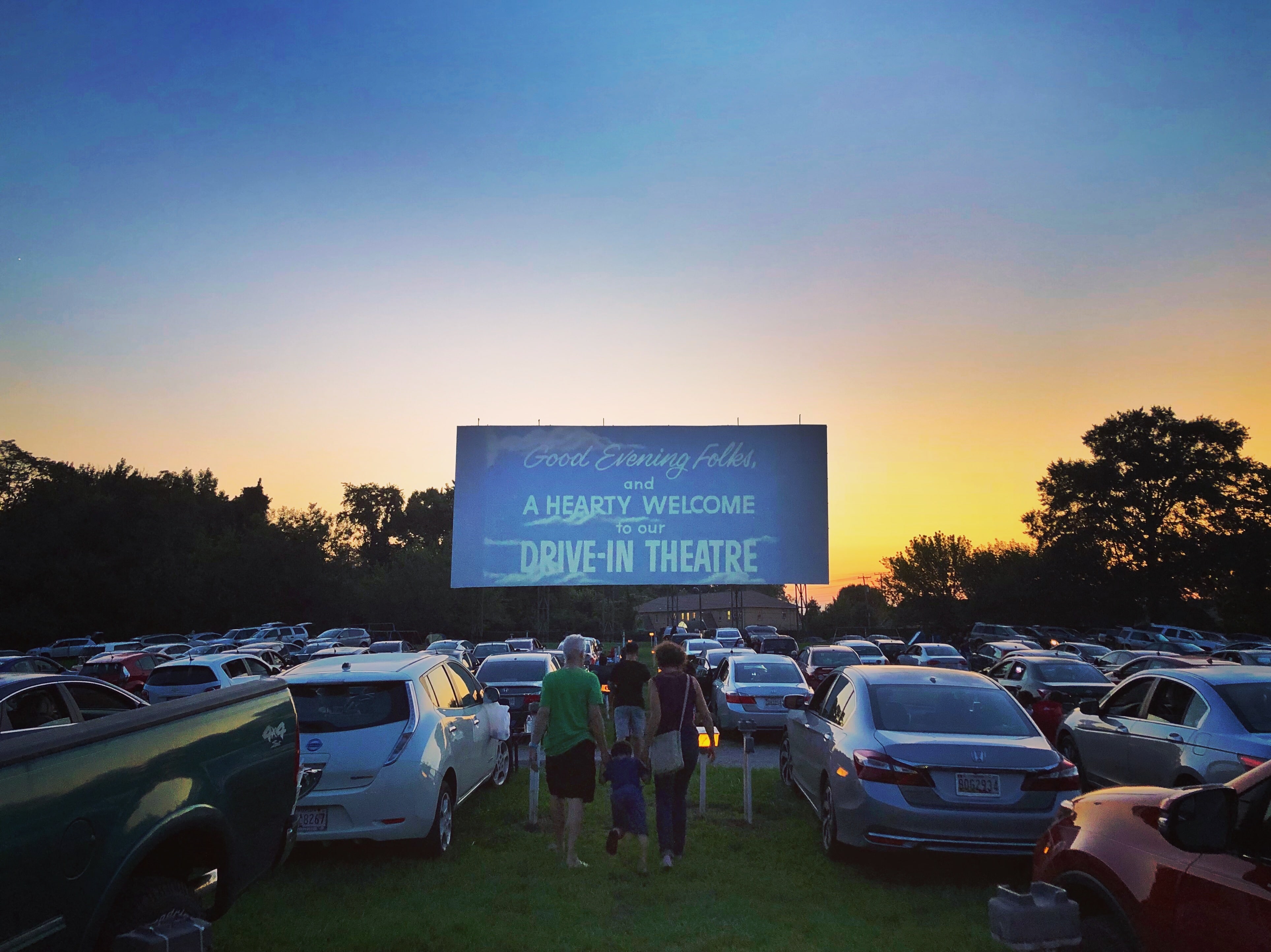 Family walking to their during sunset at the Bengies Drive-in Theatre